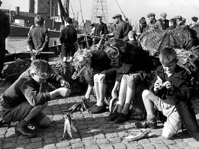 Framed Print : Prospective fishermen of England stringing their morning fry Framed Print : Prospective fishermen of England stringing their morning fry
