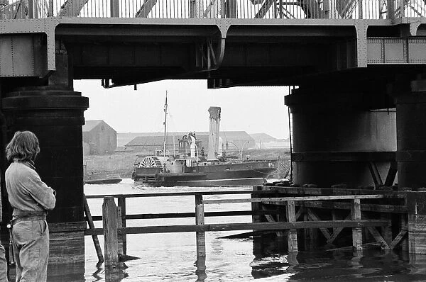 PS John H Amos, paddlewheel tugboat, built in Scotland in 1931, pictured going down river