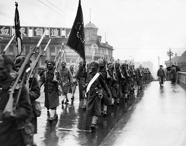 Punjab soldiers of the Shanghai Defence Force marching through the streets of