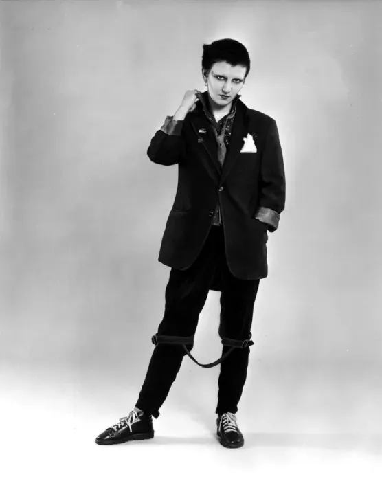 Framed Print : Punk rocker fashion Black jacket and trousers, dyed black hair Framed Print : Punk rocker fashion Black jacket and trousers, dyed black hair