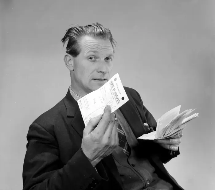 Framed Print : A punter holding his betting slips and a receipt March 1963 Framed Print : A punter holding his betting slips and a receipt March 1963
