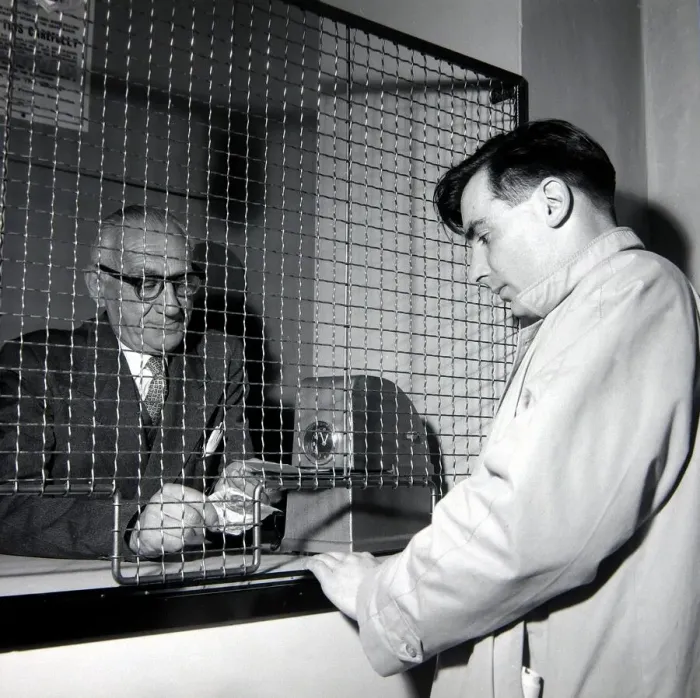 Framed Print : A punter placing a bet at William Massey betting shop in Bethnal Green Framed Print : A punter placing a bet at William Massey betting shop in Bethnal Green