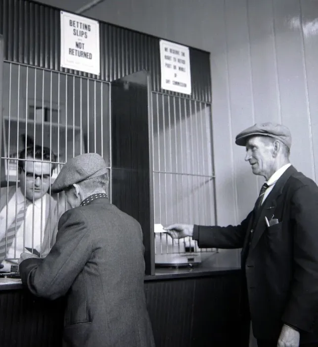 Framed Print : Punters placing their bets inside William Massie betting shop in Bethnal Green Framed Print : Punters placing their bets inside William Massie betting shop in Bethnal Green