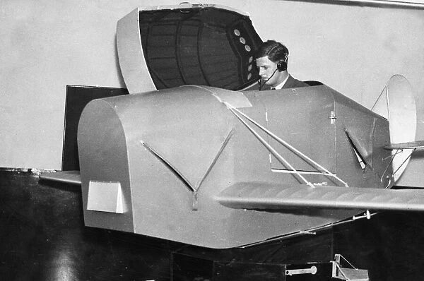 A pupil emerging from the Link trainer used for initial instruction at an RAF training