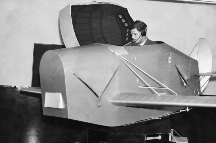 Framed Print : A pupil emerging from the Link trainer used for initial instruction at an RAF training Framed Print : A pupil emerging from the Link trainer used for initial instruction at an RAF training