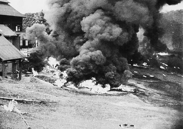 Pursuing a 'scorched earth'policy the British forces in Malaya have burnt