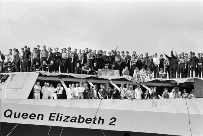 Framed Print : QE2 returns home to Southampton. Union Jacks are festooned on cars, draped on shoulders Framed Print : QE2 returns home to Southampton. Union Jacks are festooned on cars, draped on shoulders