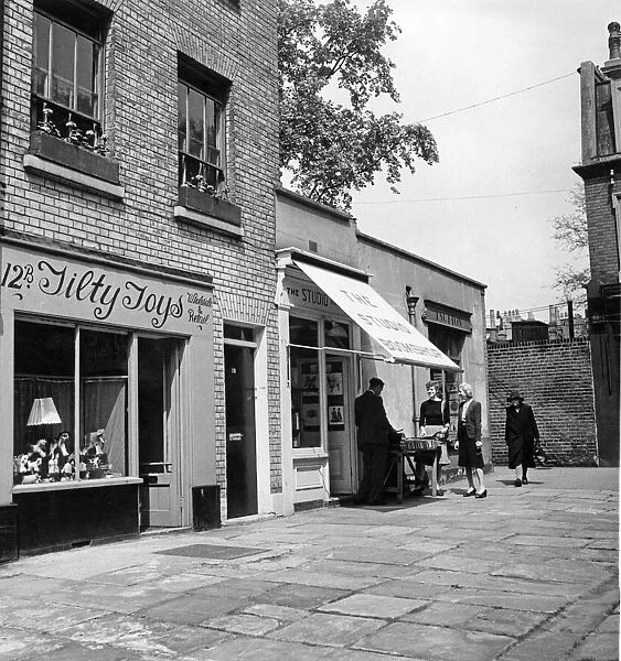 A quaint by-way of Kensington, Church Walk. London. Picture shows a toy shop