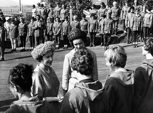 The Queen chats to girls of the Outward Bound School at Aberdovey. With her is Miss A