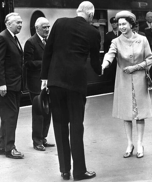 Queen Elizabeth is greeted by Lord Gardiner the Lord Chancellor at Waterloo Staion in