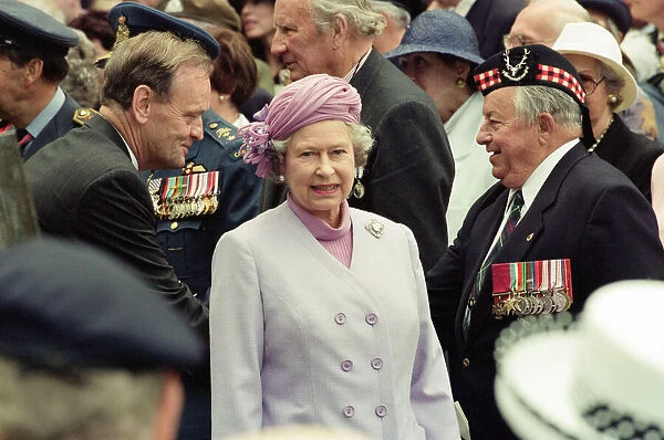 Queen Elizabeth II attends the unveiling of the Canadian War Memorial in Green Park