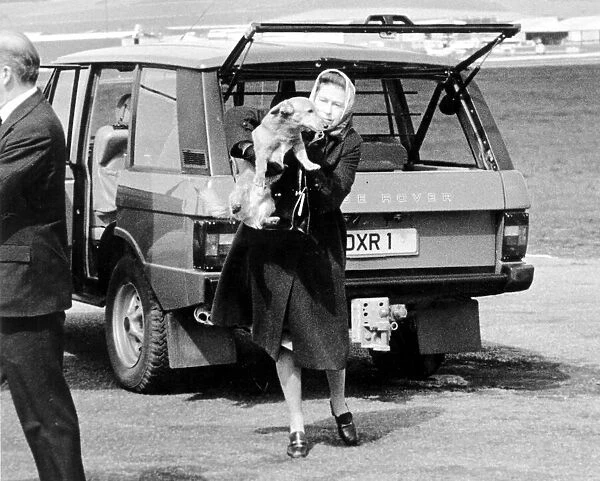 Queen Elizabeth II with one of her corgi dogs. After taking a break in Balmoral