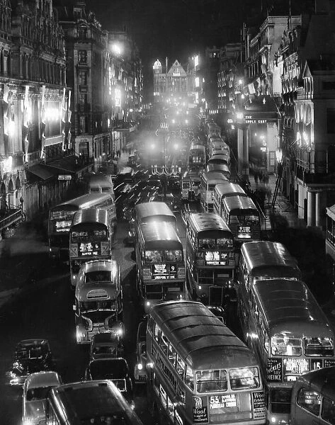 Queen Elizabeth II Coronation Buses, taxis and private cars seen here driving