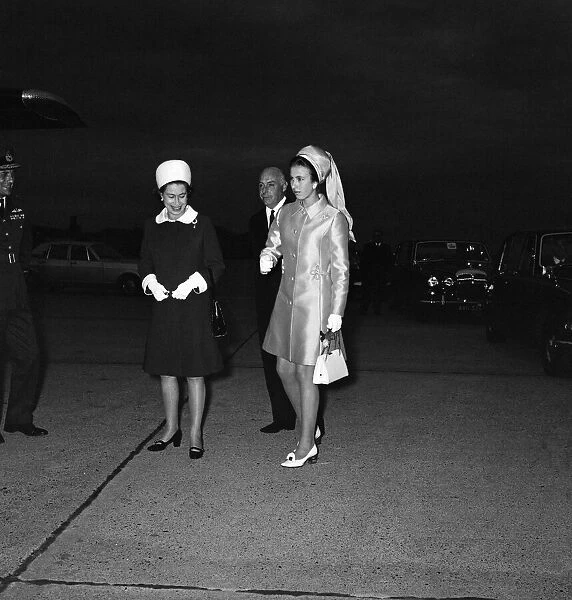 Queen Elizabeth II and her daughter Princess Anne at Heathrow Airport after returning