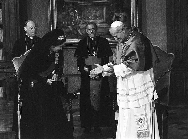 Queen Elizabeth II and the Duke of Edinburgh visit the Vatican to meet Pope John Paul II