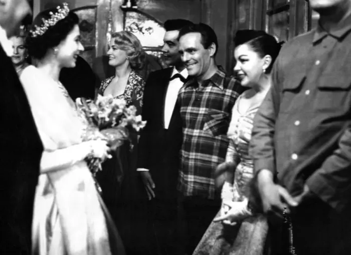 Framed Print : Queen Elizabeth II has a happy smile as she congratulates Judy Gardland on her Framed Print : Queen Elizabeth II has a happy smile as she congratulates Judy Gardland on her