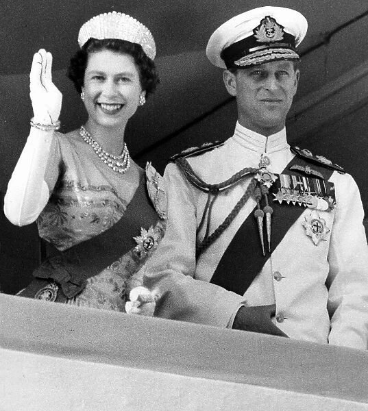 Queen Elizabeth II and her husband Prince Philip waving at Kaduna
