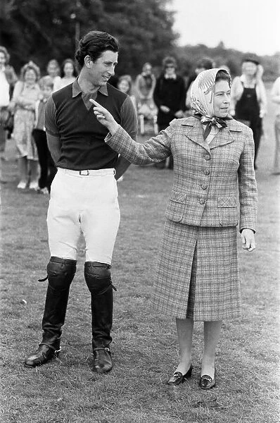 Queen Elizabeth II, June 1979 The Queen shows Prince Charles the sign at a polo