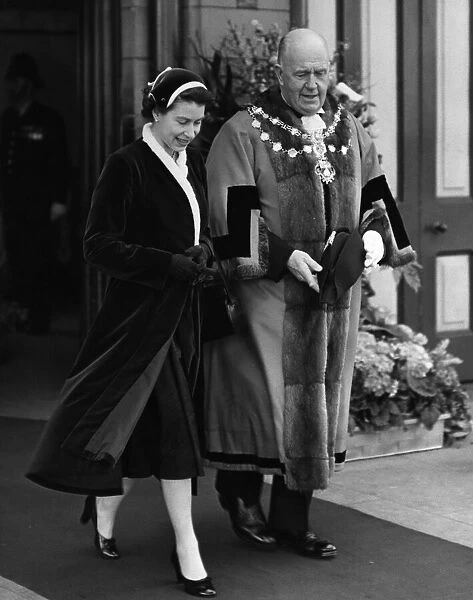 Queen Elizabeth II with the Mayor of Morecambe as they leave the station, Morecambe
