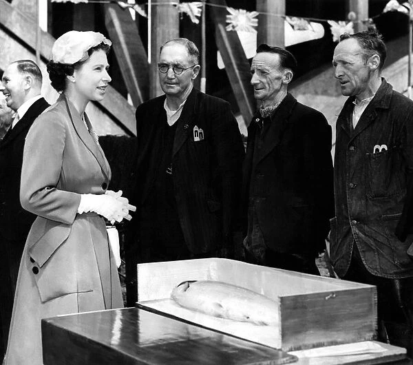 Queen Elizabeth II meeting three local men during a visit to the North East