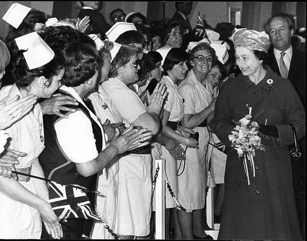 Queen Elizabeth II in Merseyside greeting local nurses, on a walkabout