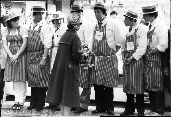 Queen Elizabeth II in Merseyside speaking with local workers