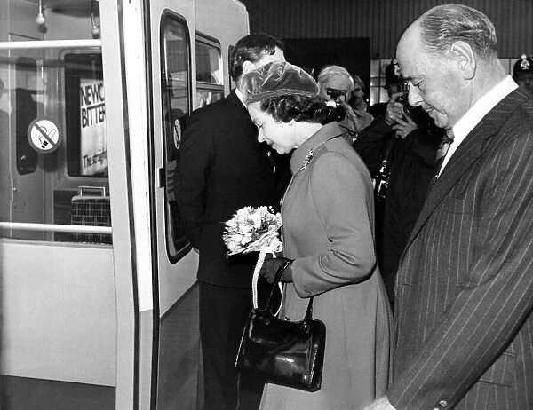 Queen Elizabeth II and Prince Philip board the Metro Train at Gateshead station to leave