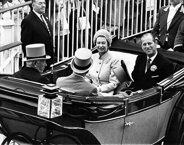 Queen Elizabeth II and Prince Philip drive down the course at Royal Ascot