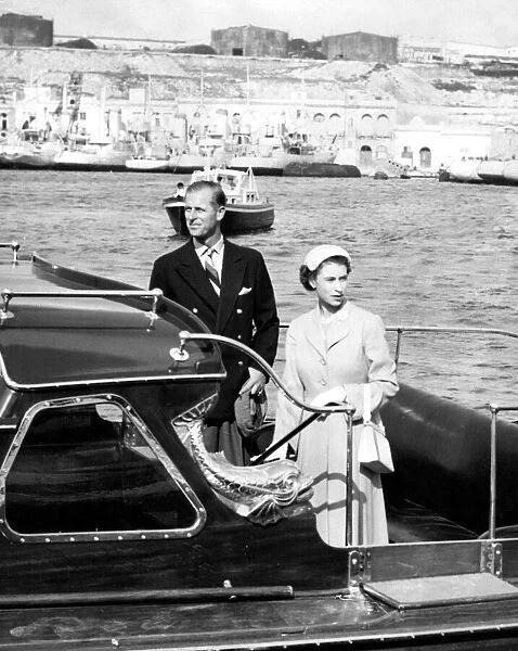 Queen Elizabeth II and Prince Philip leave Malta harbour to go aboard the Royal Yatch