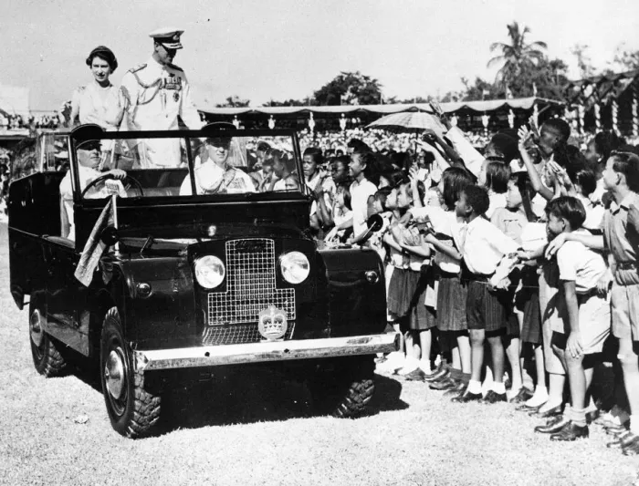 Framed Print : Queen Elizabeth II and Prince Philip smile at waving schoolchildren during heir visit to Framed Print : Queen Elizabeth II and Prince Philip smile at waving schoolchildren during heir visit to
