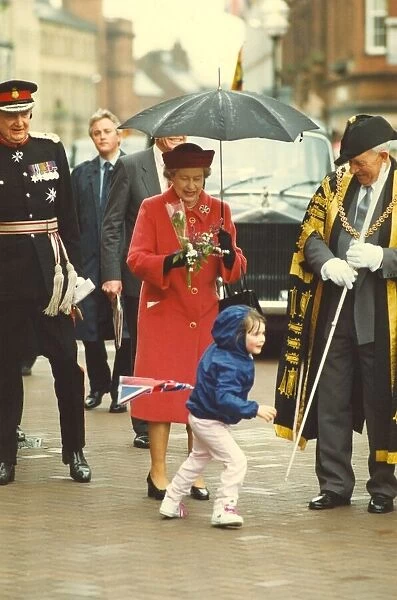 Queen Elizabeth II and Prince Philip visit Cumbria 3 May 1991 - receiving some flowers