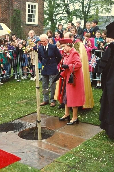 Queen Elizabeth II and Prince Philip visit Cumbria 3 May 1991- planting a tree