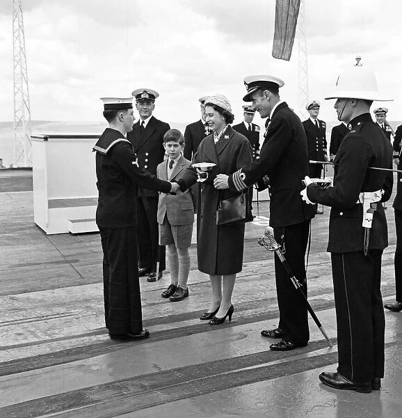 Queen Elizabeth II and the Prince of Wales visit HMS Eagle at Weymouth. 29th April 1959