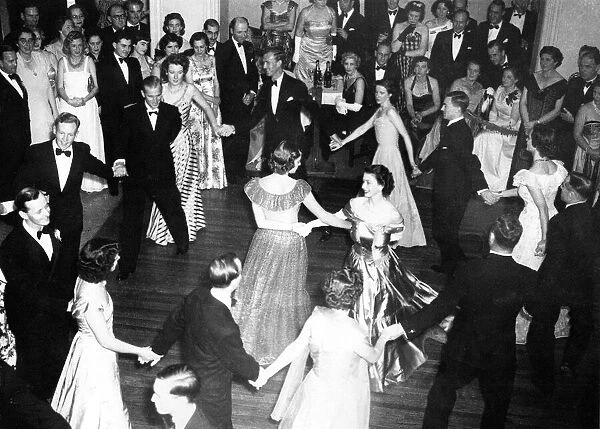 Queen Elizabeth II, Princess Elizabeth dances arms linked with Lady Pamela Mountbatten