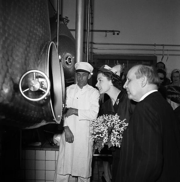 Queen Elizabeth II and the royal party visit a state farm in Denmark. 25th May 1957