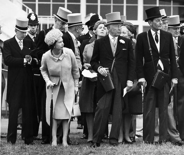 Queen Elizabeth II takes a close look at the parade of the Oaks runners at Epsom with