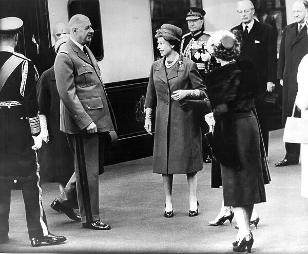 Queen Elizabeth II at Victoria Station greeting the arrival of Charles De Gaulle