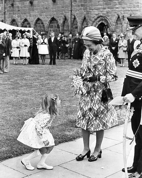 Queen Elizabeth II, visiting Hexham Abbey, is greeted by Heather Jackson