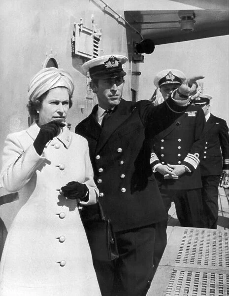 Queen Elizabeth II visits HMS Norfolk and is shown around by Prince Charles