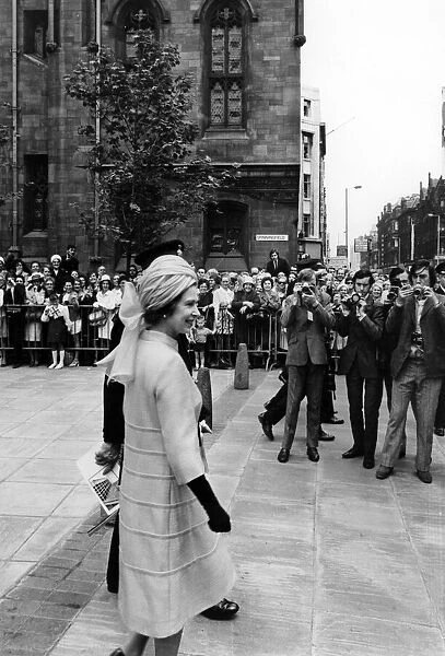 Queen Elizabeth II visits Manchester. The Queen walks through the Manchester Evening News