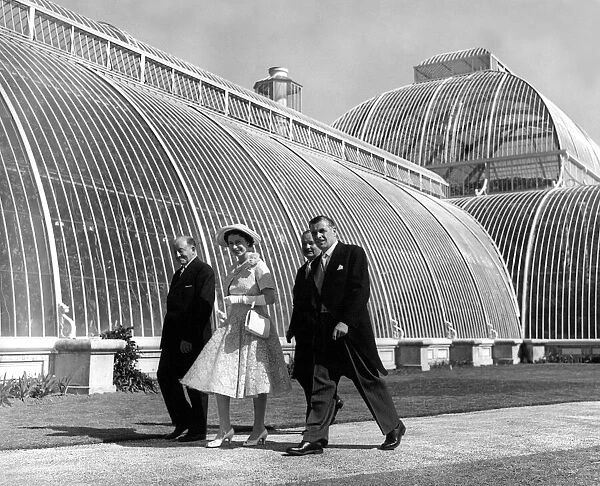 Queen Elizabeth II walking past the Palm House during her tour of Kew Gardens