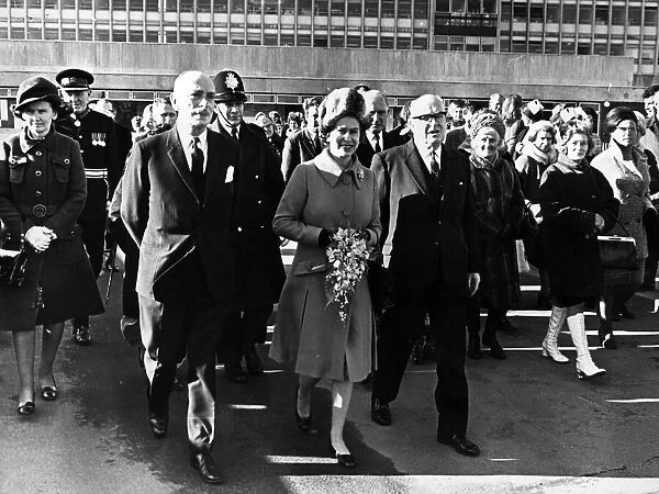 Queen Elizabeth II walks to Cardigan House from the hospital with Dr J. P