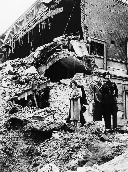 Queen Elizabeth and King George VI tour bomb sites during the Blitz of London