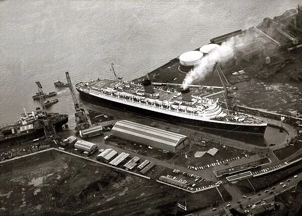 The Queen Elizabeth being laid up in dry dock on the Clyde for re-fit