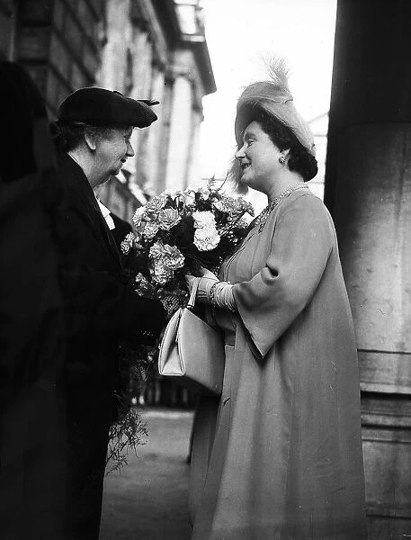 Queen Elizabeth (now the Queen Mother) receives a bouquet from Rose Riana, 71