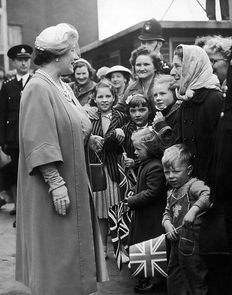 Queen Elizabeth the Queen Mother greets crowds gathered outside the Great Colmore Street