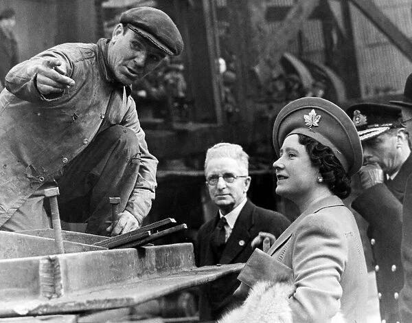 Queen Elizabeth The Queen Mother talking to a shipyard worker