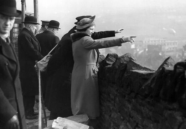 Queen Elizabeth visits Swansea to survey the damage caused by Nazi air raids. 1941