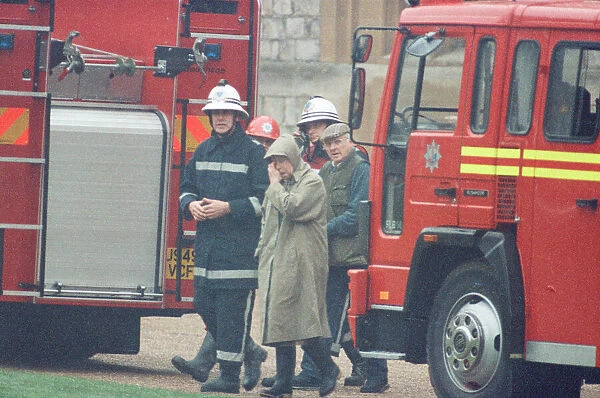 The Queen is escorted by the chief fire officer around the grounds of Windsor Castle as