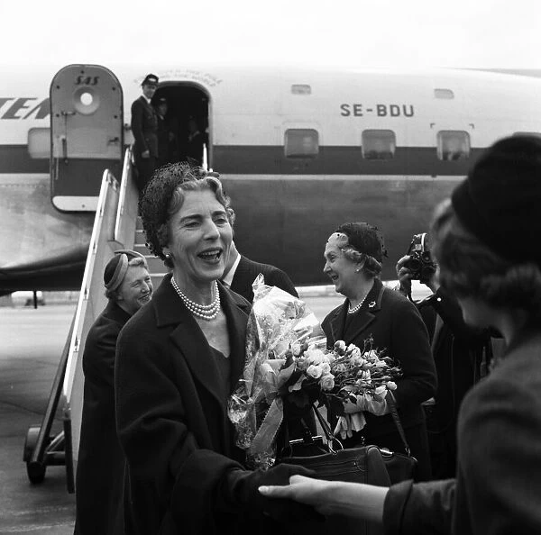 Queen Ingrid of Denmark arrives at London Airport ahead of the Royal Wedding